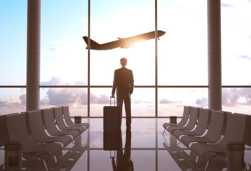 Businessperson standing in an airport