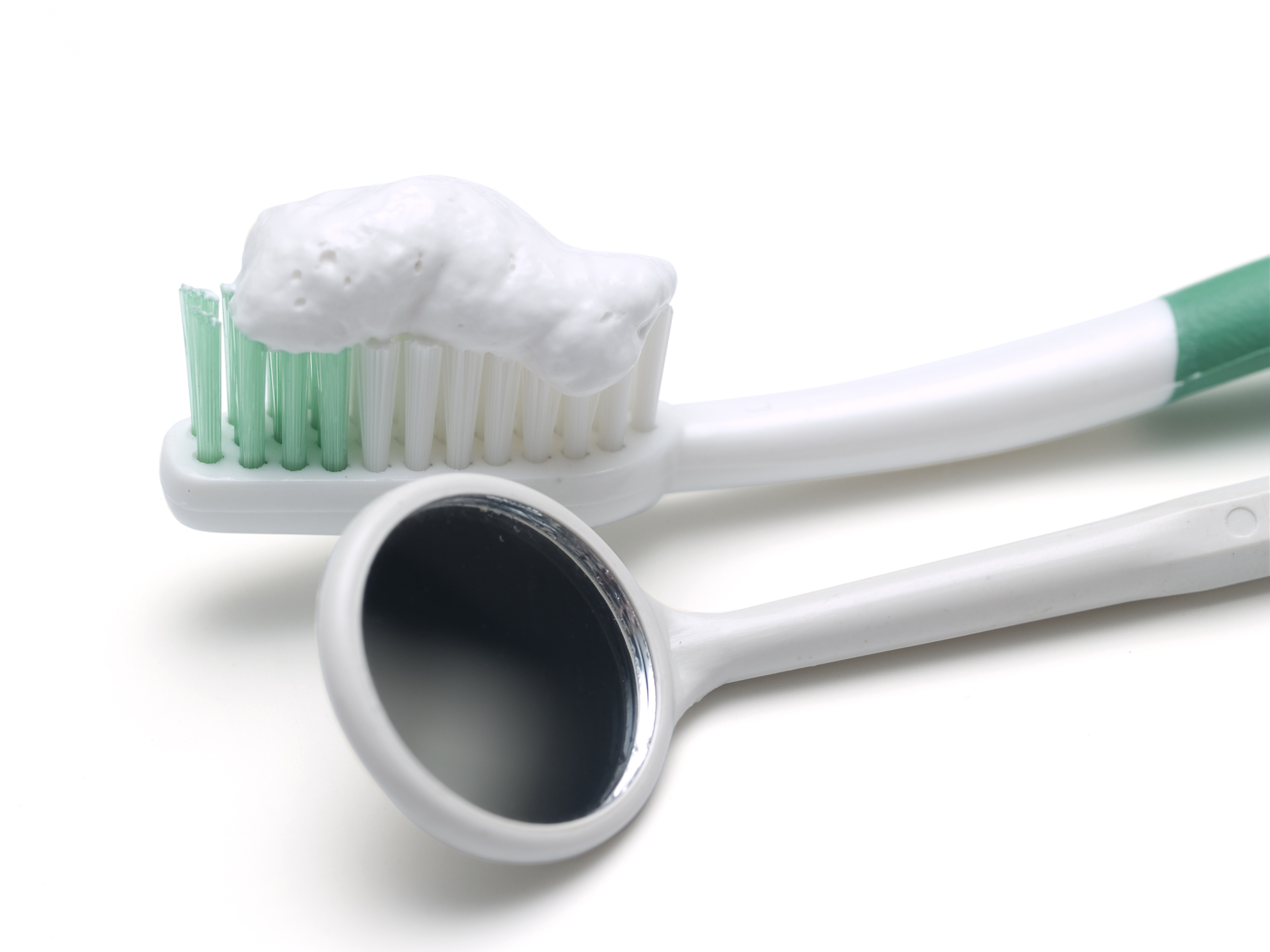 Toothbrush with toothpaste and dental mirror
