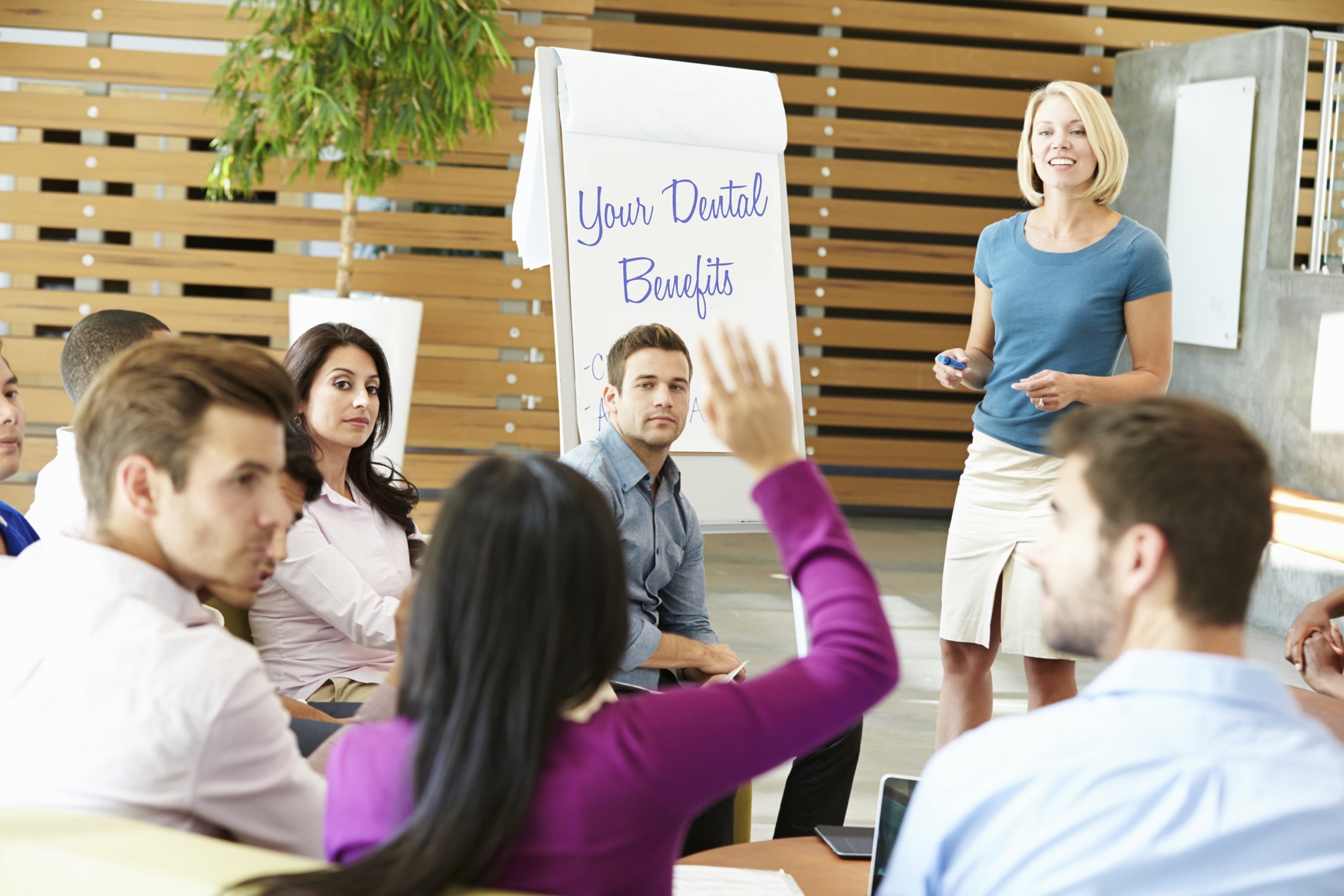 Group of employees and a broker meeting for open enrollment