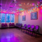 multicolored string lights around a dental office waiting room