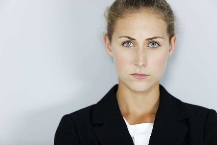 Attractive business woman looking stressed and concerned.