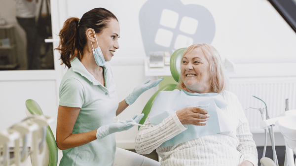 dentist and patient - green chairs