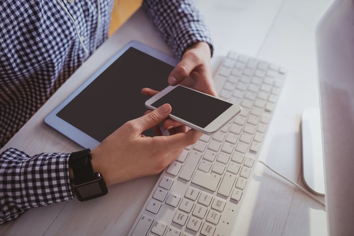 Close up view of businesswoman with technologies at her desk in office