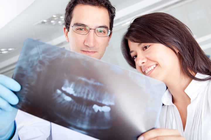 Dentist looking at an x-ray at the hospital