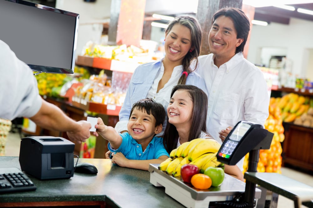 Family looking out for home finances at the supermarket