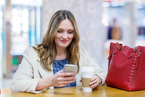 Young woman with phone on social media