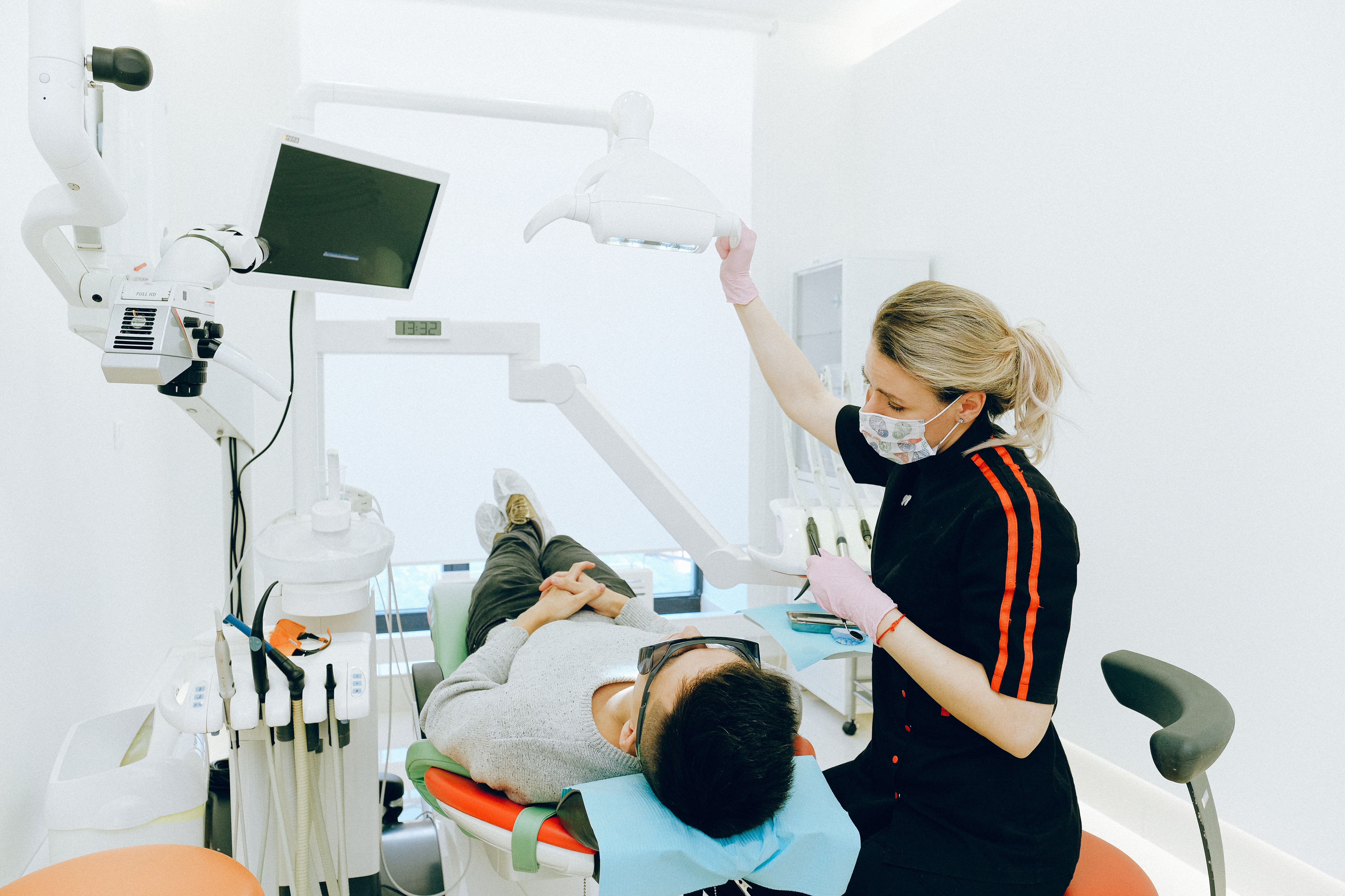 woman-dentist-man-having-dental-check-up-providers-challenges