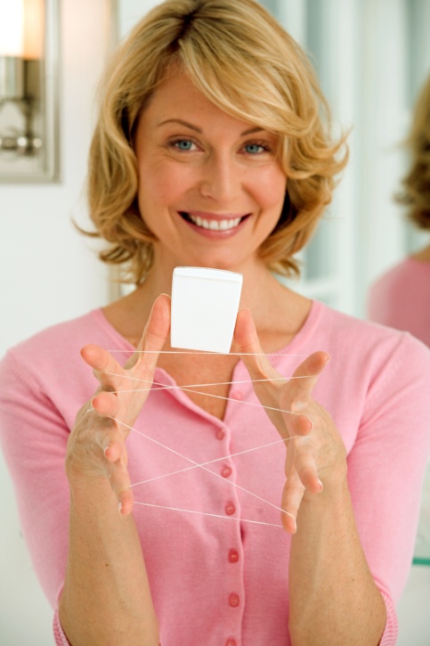 Women-with-dental-floss-smiling