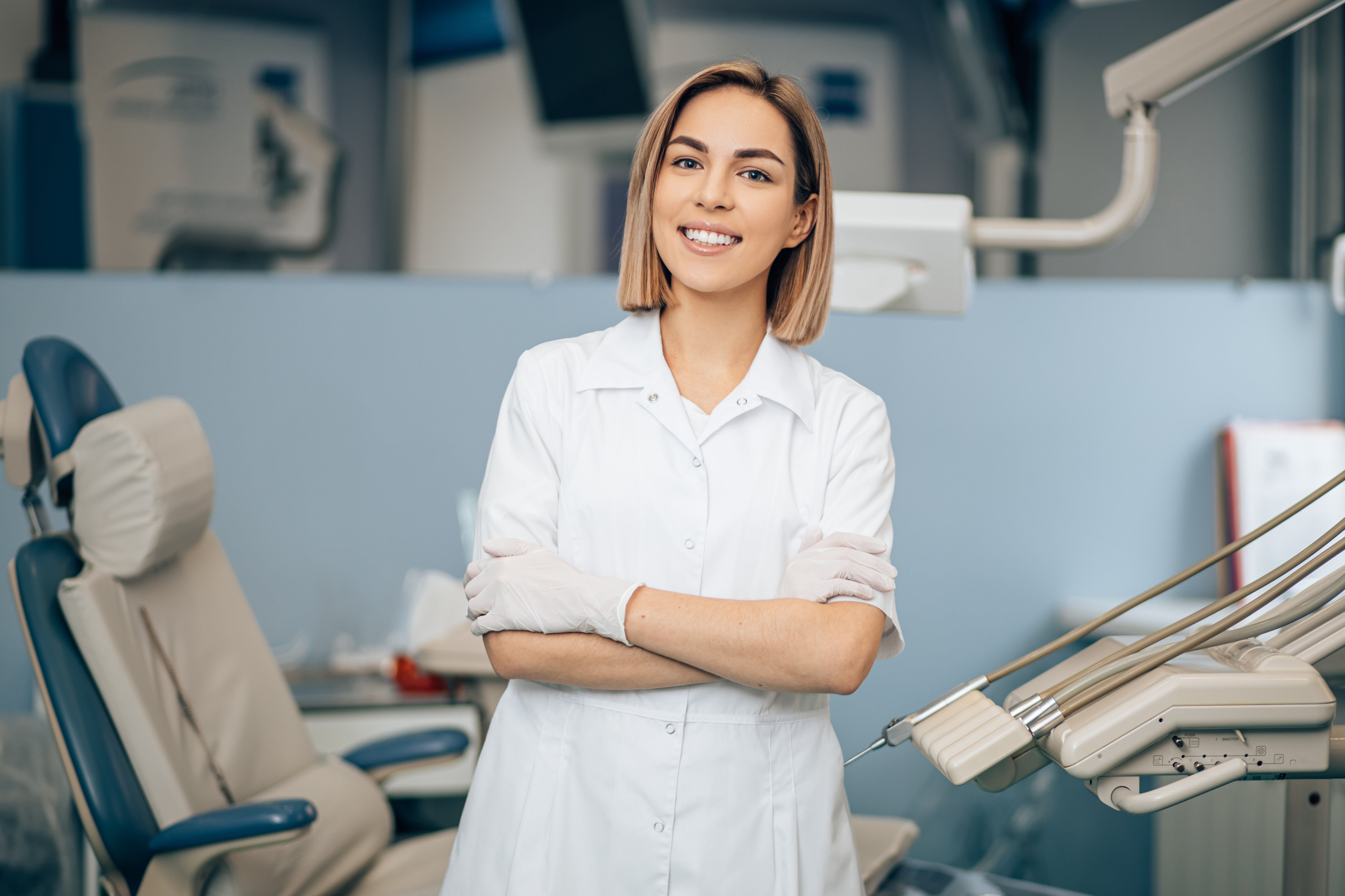 Smiling Dentist Discussing Dental Insurance Coverage 