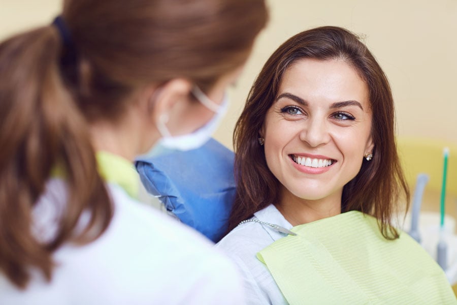 Smiling woman in the dentist chair