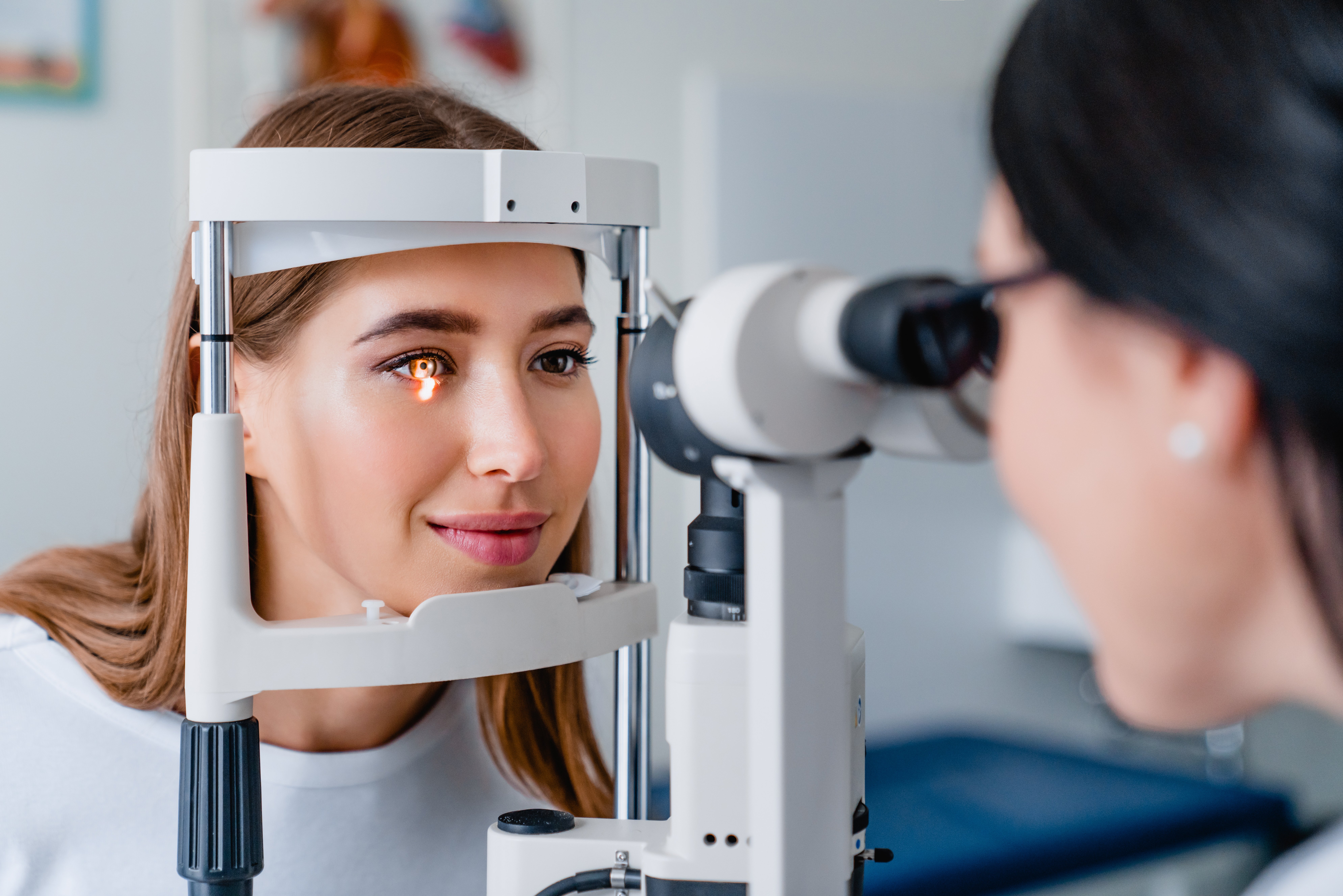 Smiling woman having a comprehensive eye exam
