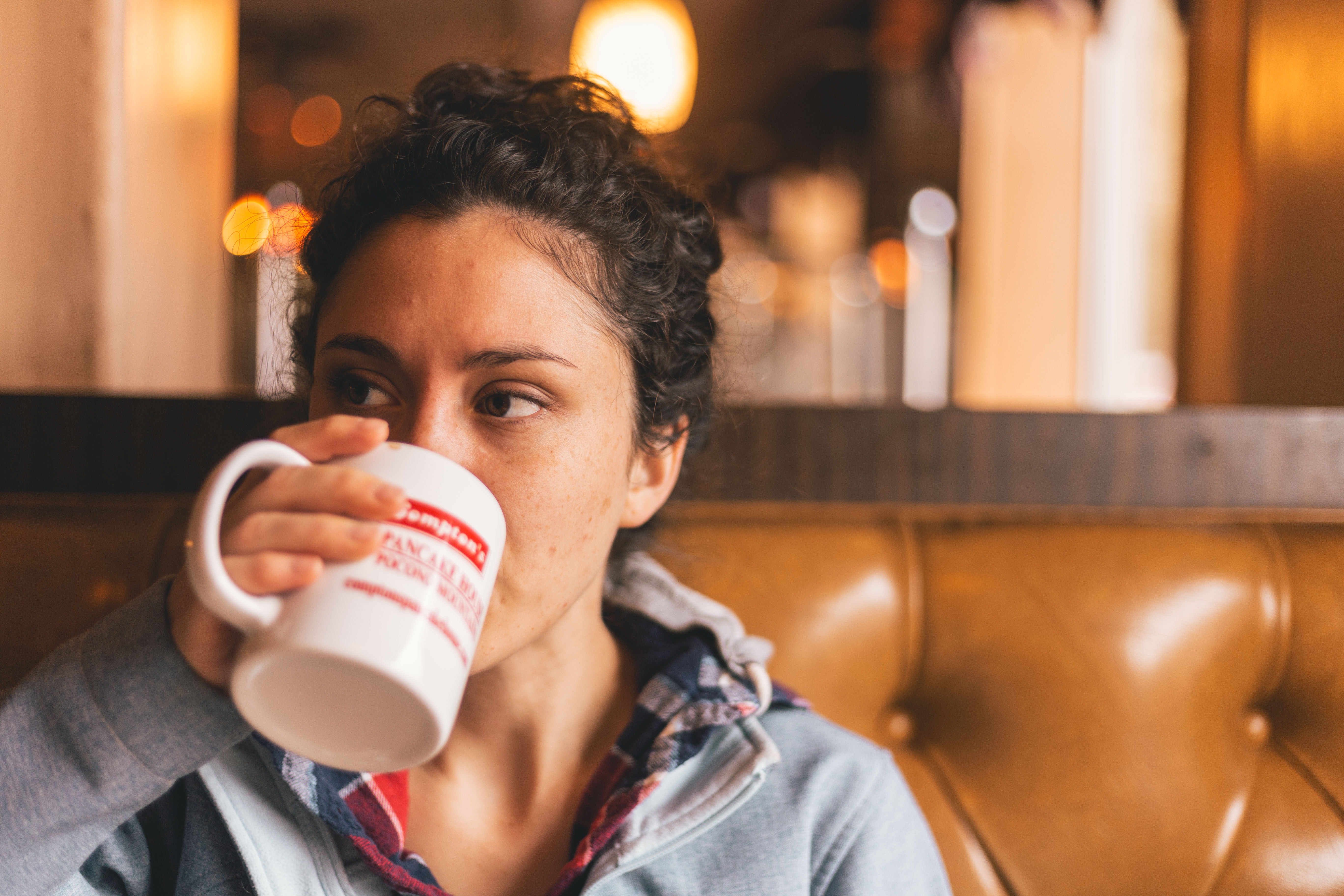Woman drinking cup of coffee