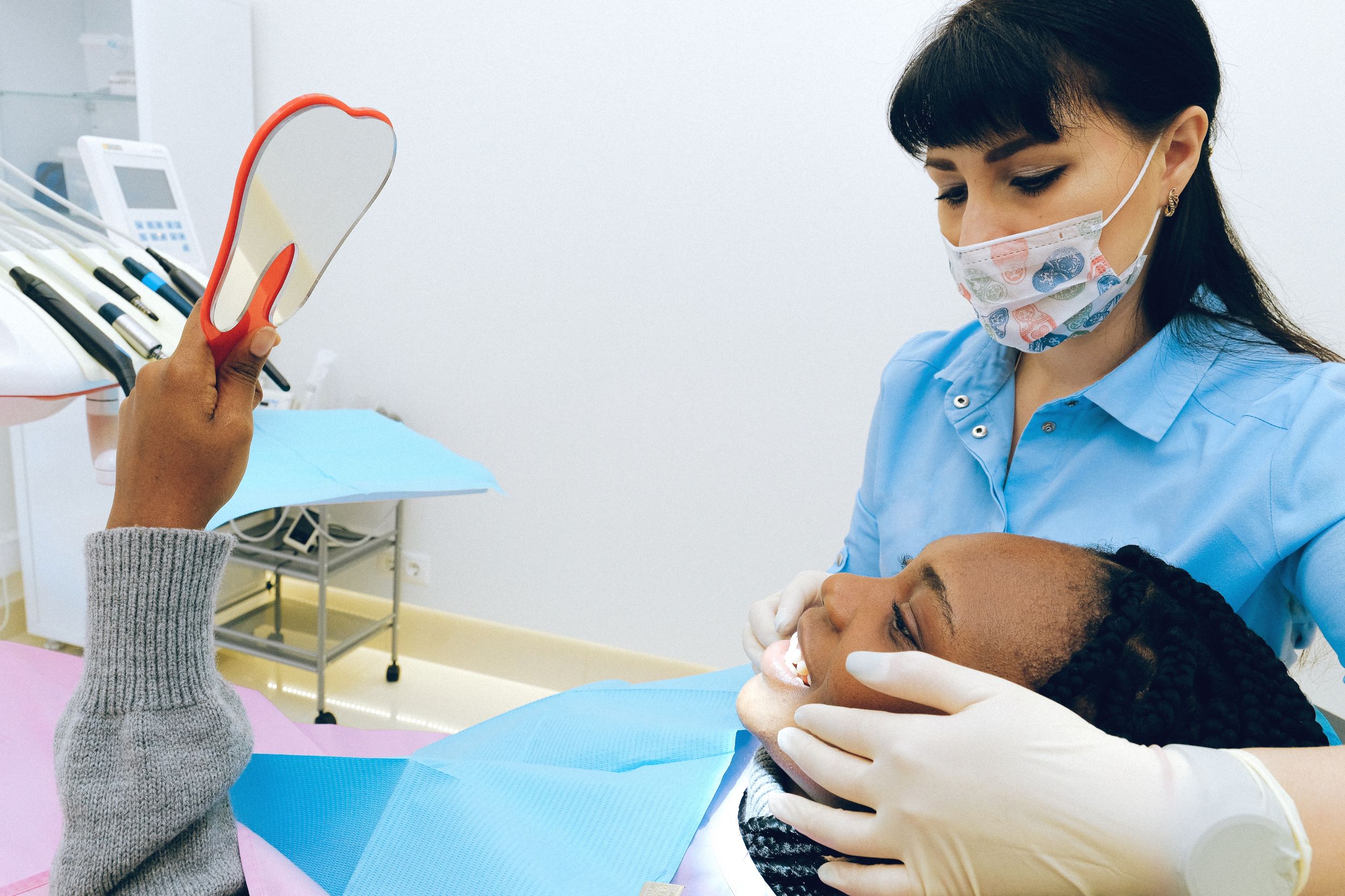 A dental professional in protective gear practices infection control dentistry