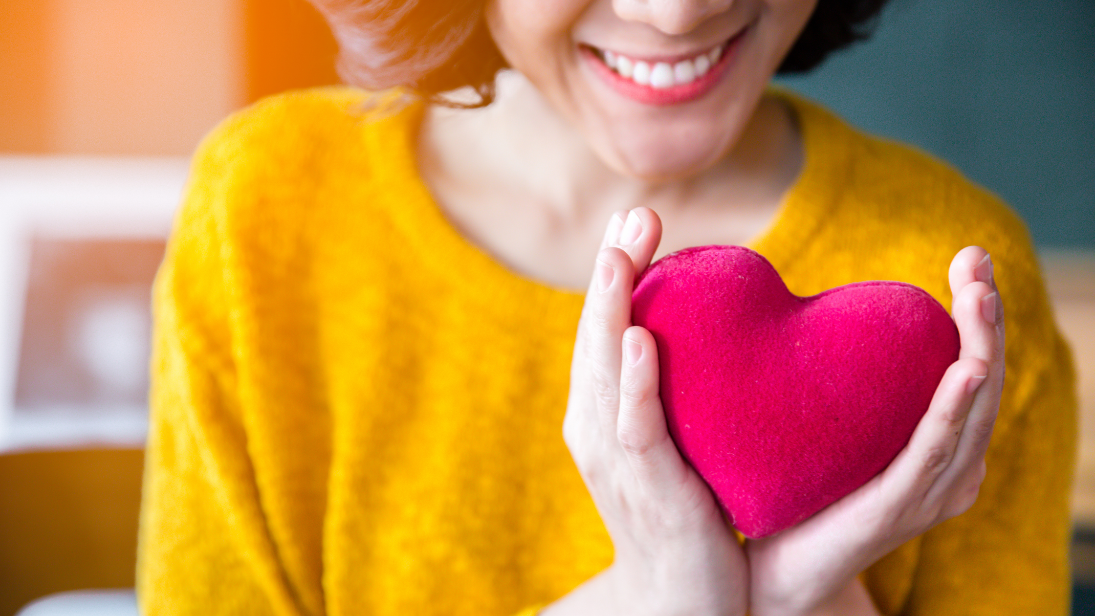 Woman looking at a healthy heart