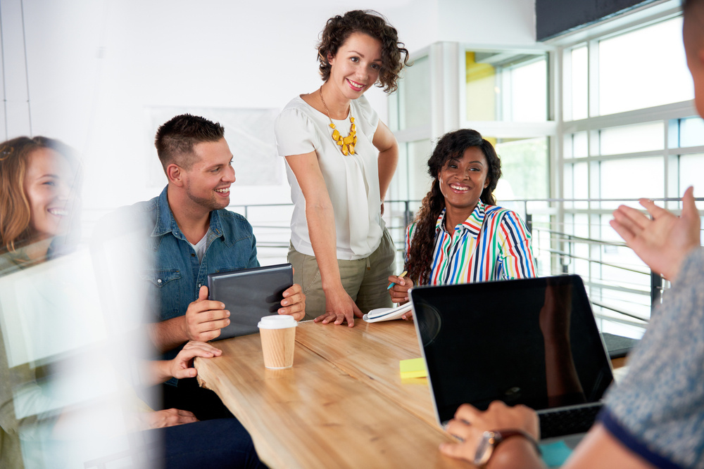 Group of smiling people in a business meeting