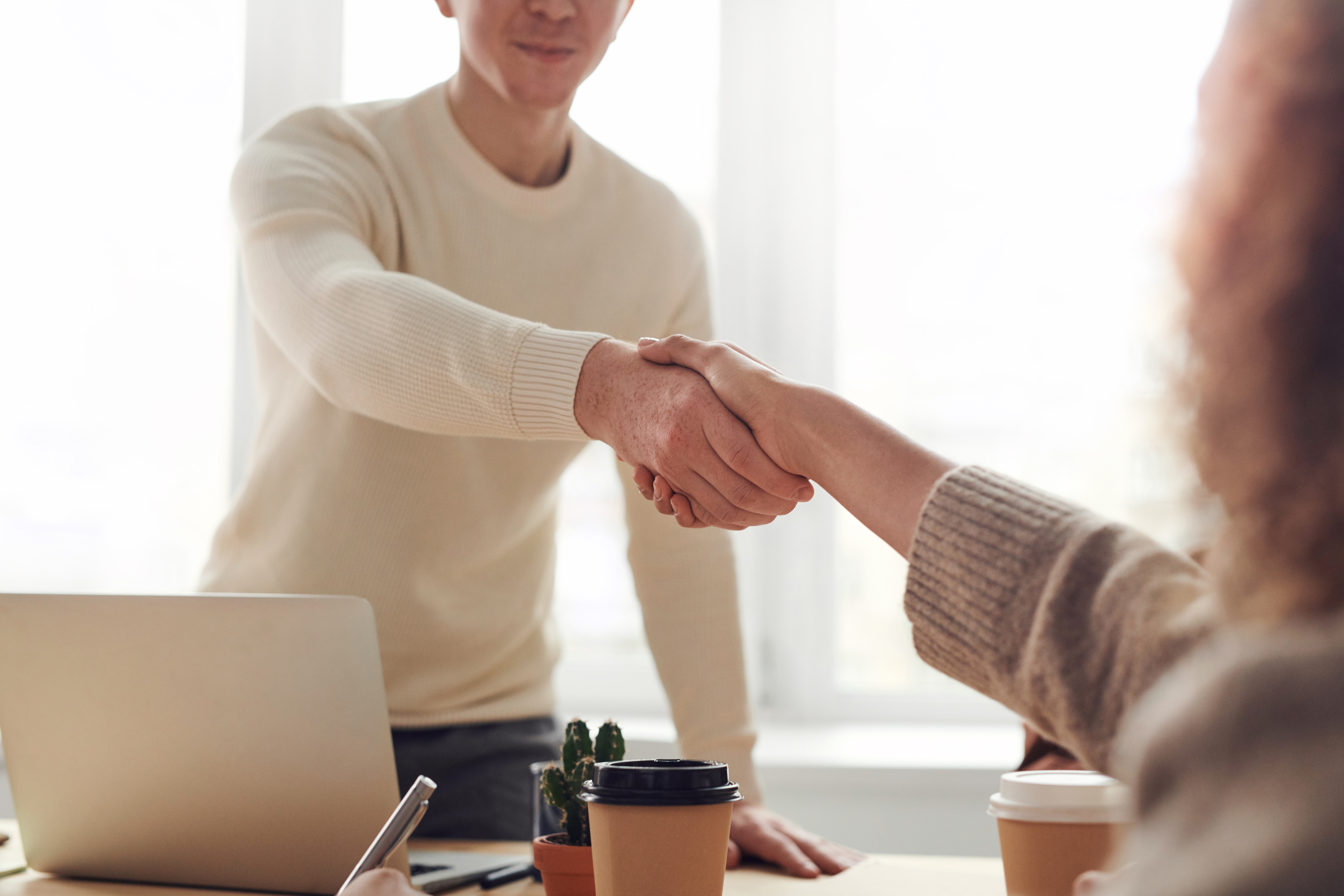 Insurance agent shaking hands with a client