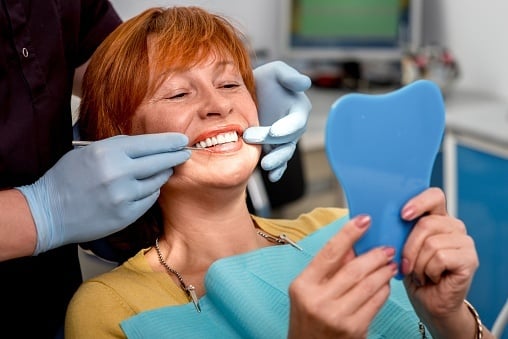 Woman being examined by dentist