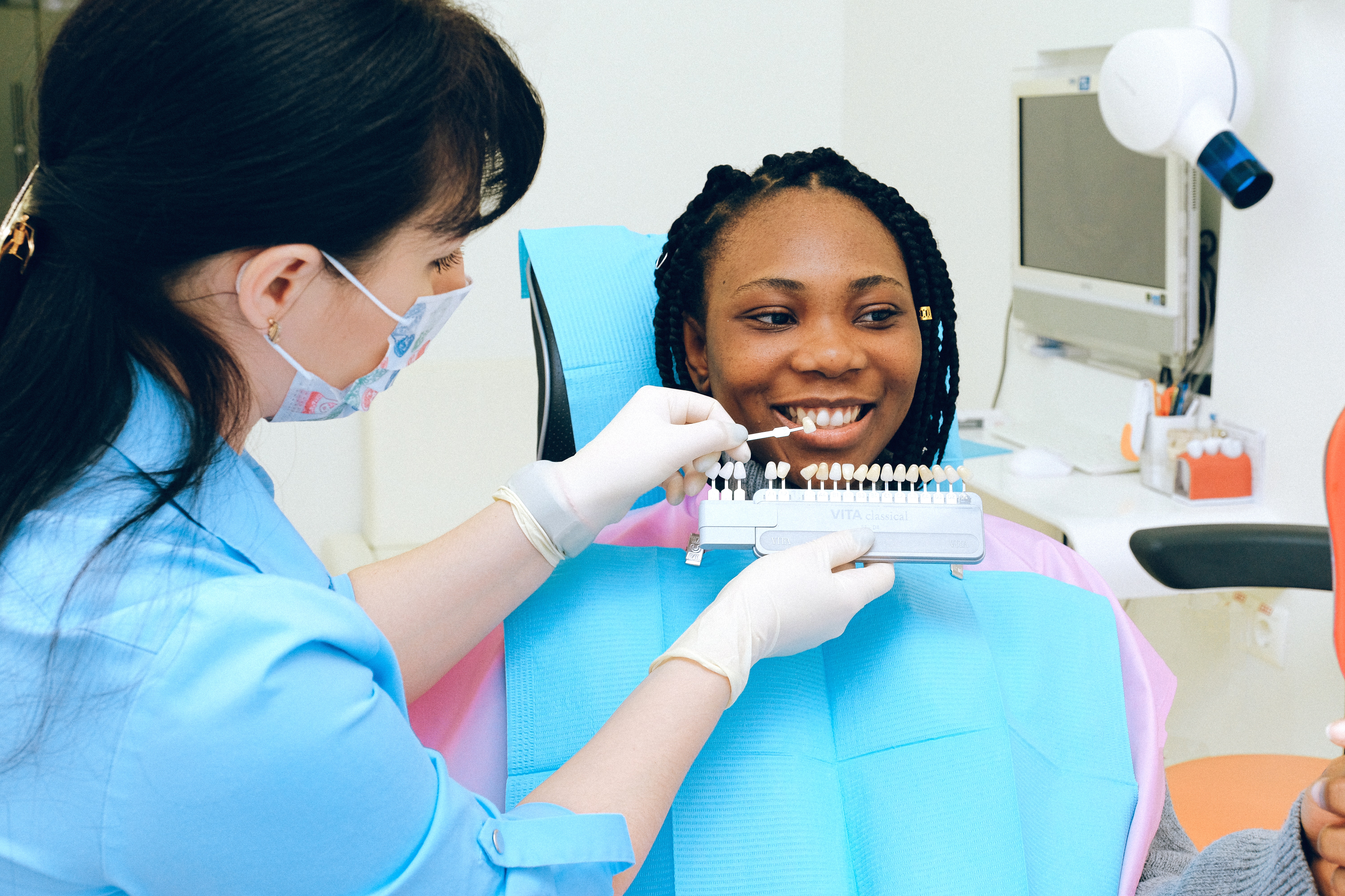 Woman smiling during dentist appointment