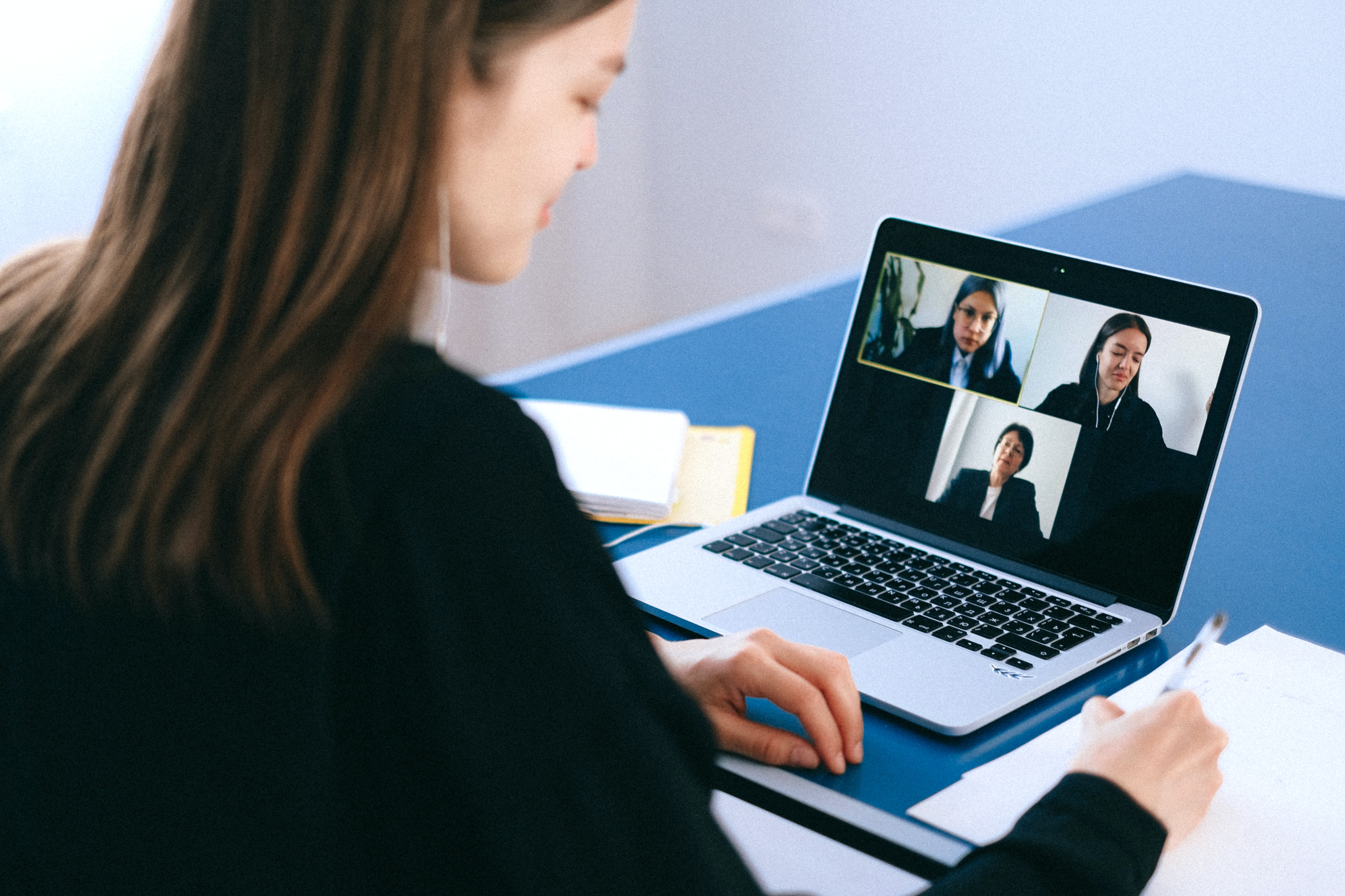Woman meeting with clients virtually