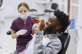 man sitting in dentist chair