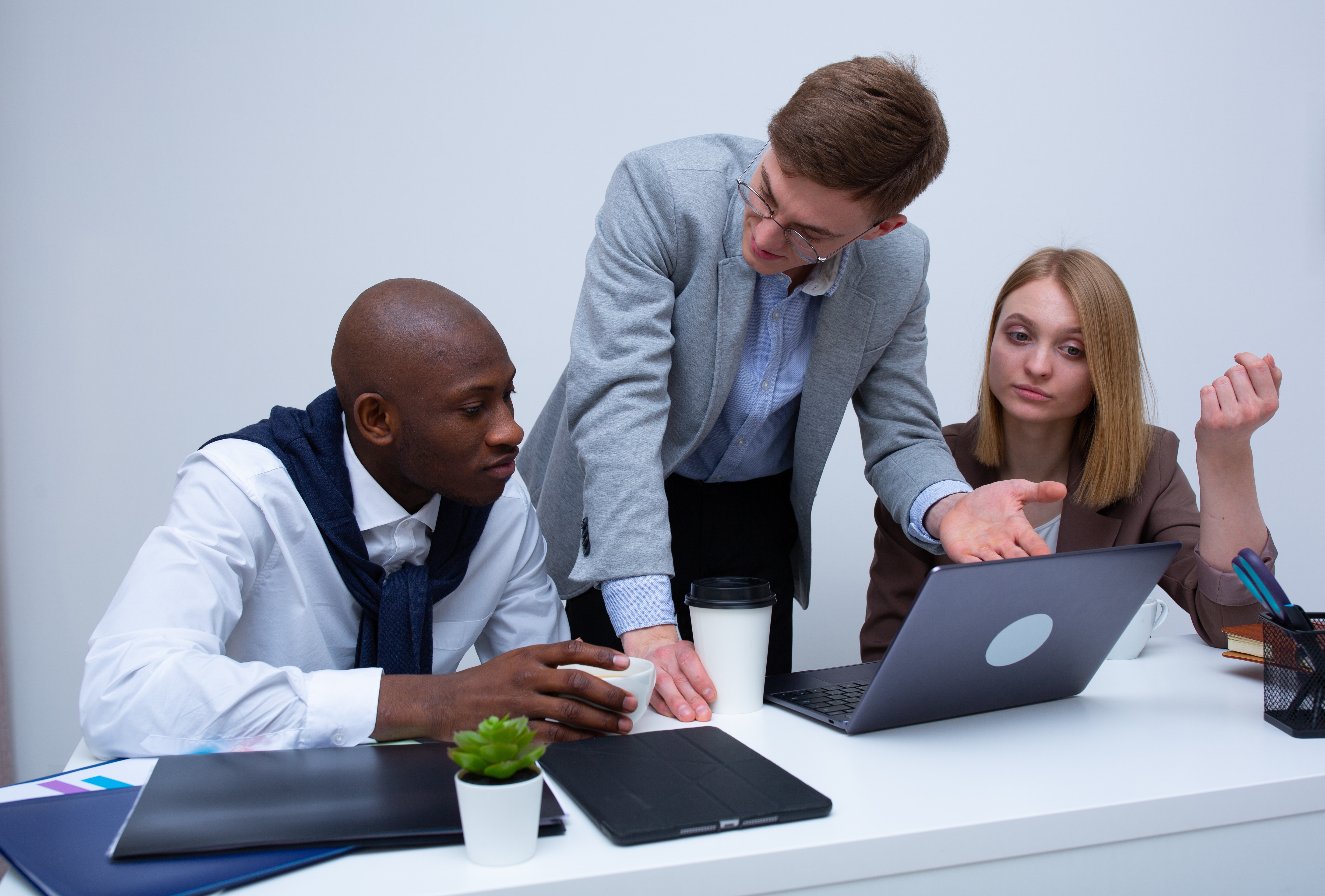 Broker explaining individual dental insurance to sitting clients 