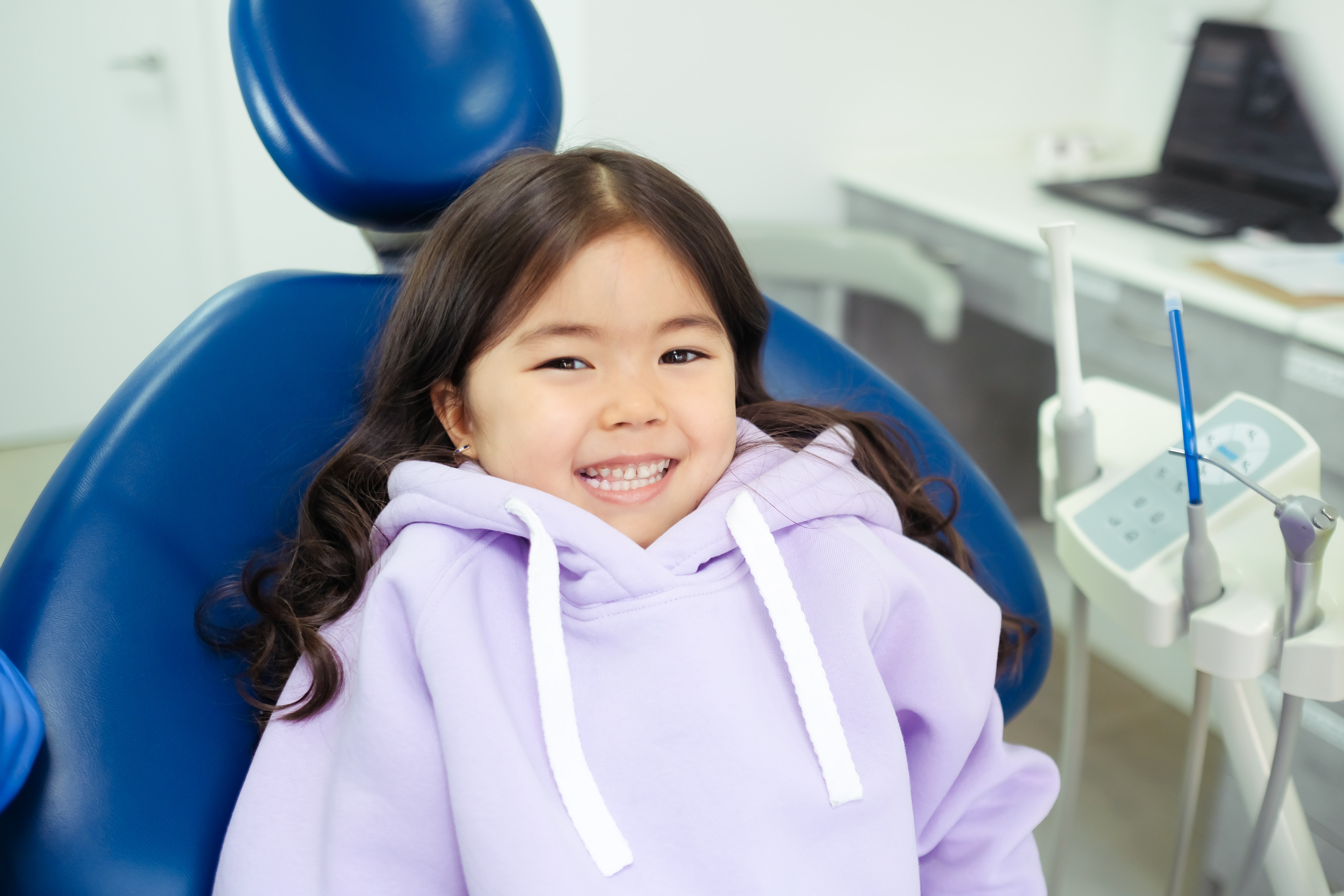 A happy little girl at her back-to-school child dental visit